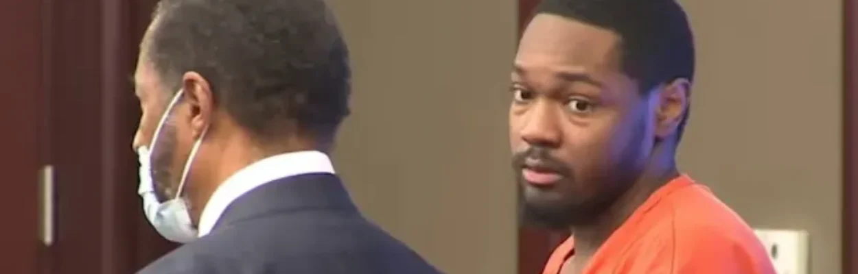 Justin Golden stands in court with his attorney to be sentenced for his baby's death.