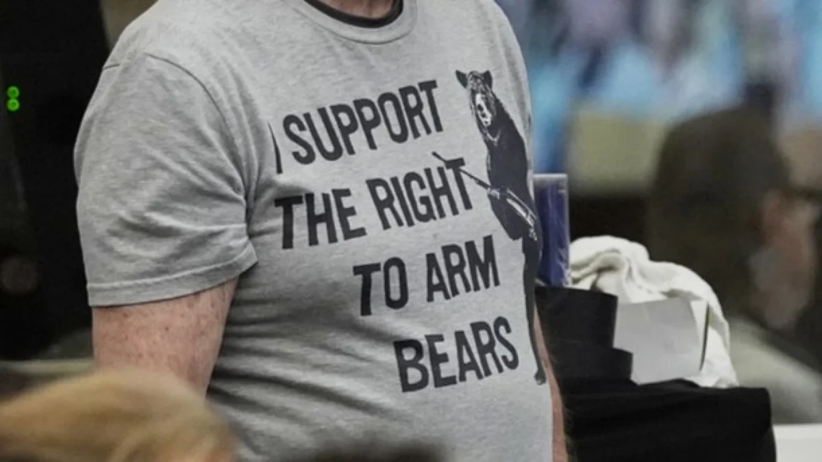 A man waits his turn to speak at a Florida Fish and Wildlife Commission hearing about proposed bear hunting in May 2025.