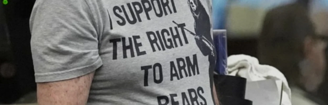 A man waits his turn to speak at a Florida Fish and Wildlife Commission hearing about proposed bear hunting in May 2025.