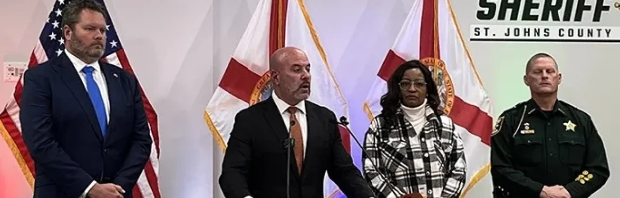 Florida CFO Blaise Ingoglia and others stand at a lectern to discuss illegal immigration priorities.