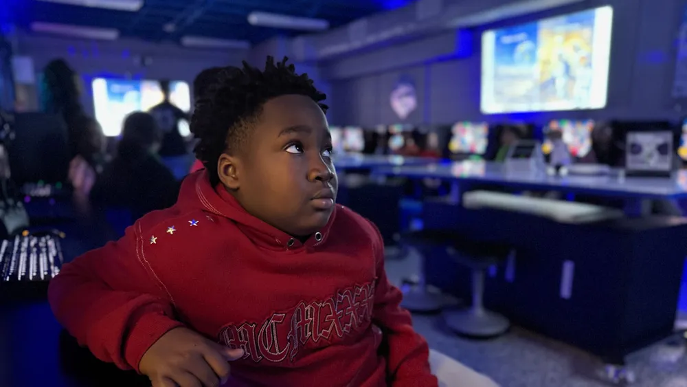 A student from Fort Caroline Elementary sits in the district's new 3D printing lab.