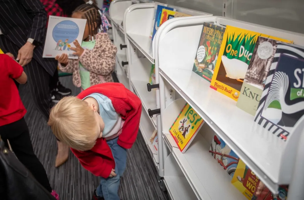 A child looks at books. Tuesday will be Family Literacy Night at the Cummer Museum.