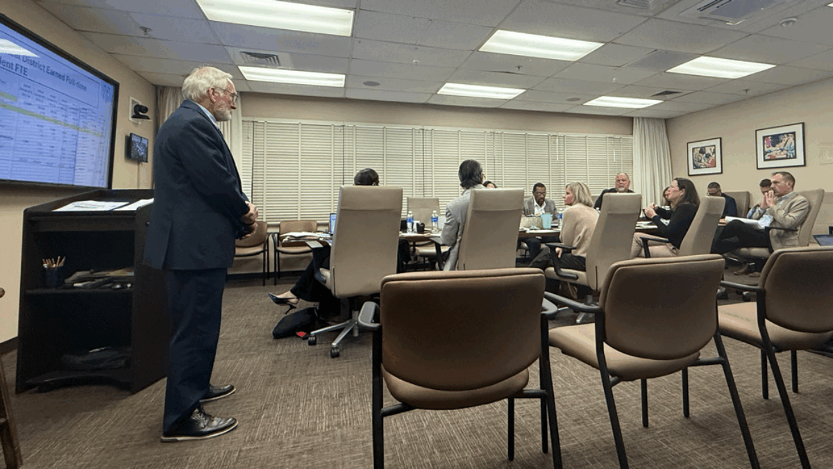 Duval Schools CFO Ron Fagan, left, gives a presentation to school board members about the district's finances on Dec. 8, 2025. | Megan Mallicoat, Jacksonville Today