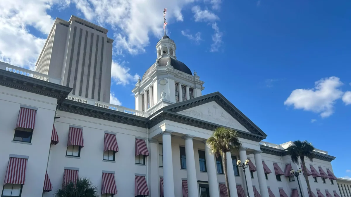 A picture of the Florida Old Capitol with the tower of the new Capitol rising in the background.