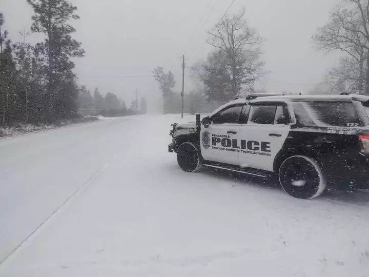 A Pensacola police car sits in the snow last winter.