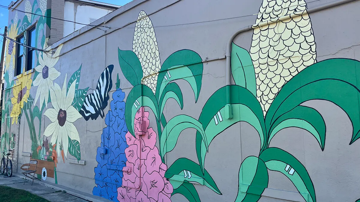 An agriculture-themed mural adorns the side of a building along Hastings' historic Main Street.