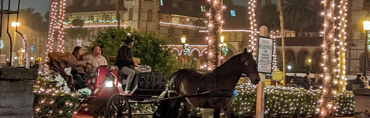 A horse-drawn carriage on a street in St. Augustine during Nights of Lights
