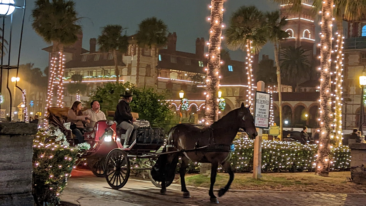 A horse-drawn carriage on a street in St. Augustine during Nights of Lights