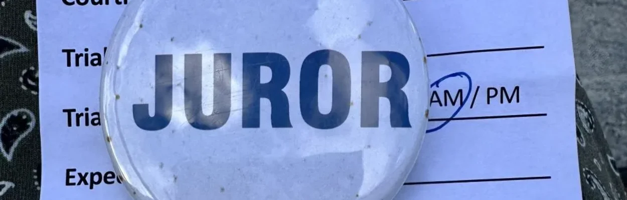 A badge signifying that someone is on jury duty.