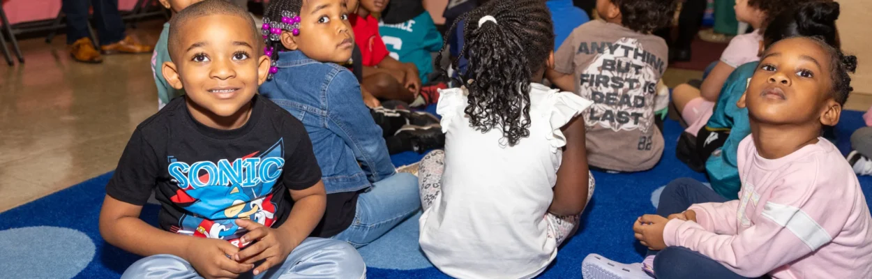 Children site on the floor at Kreative Minds Academy.