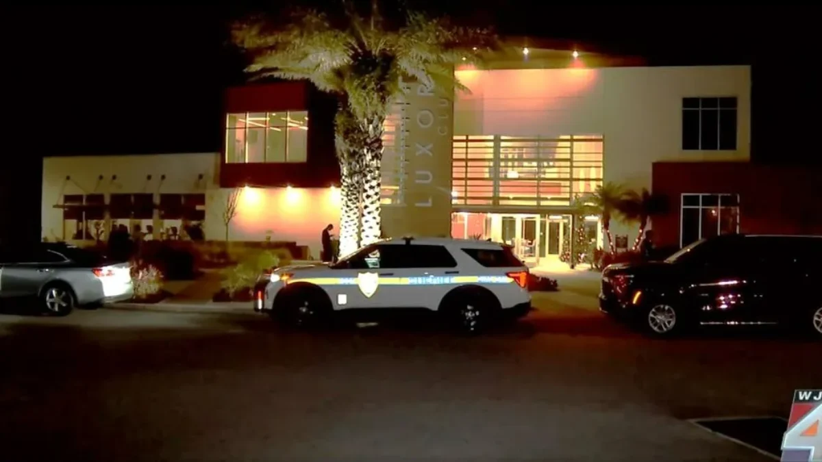 Police cars at the Luxor Club Apartments, site of a shooting involving police officers.