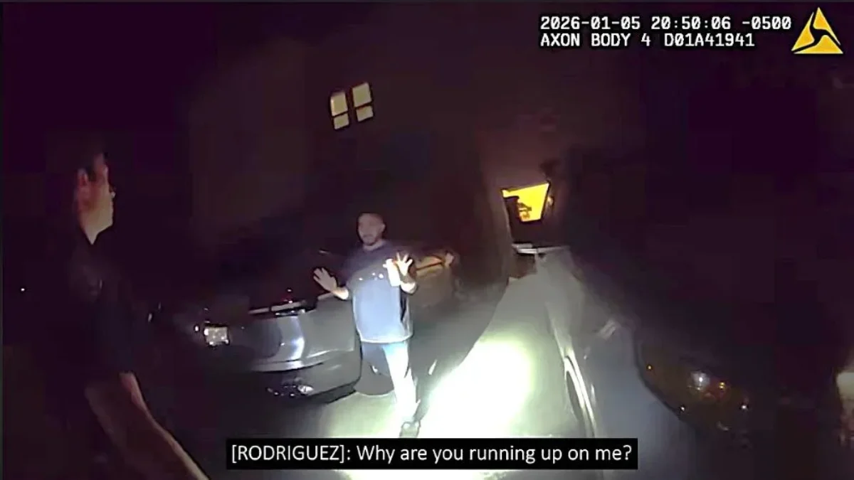 Police confront a man before a shooting.