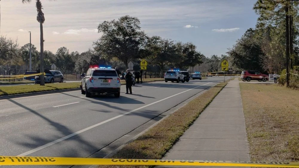 Police investigate the minibike crash.