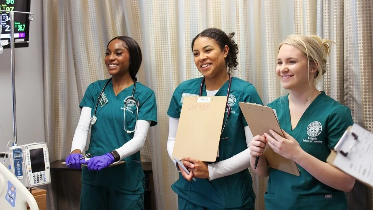 Three nursing students in scrubs
