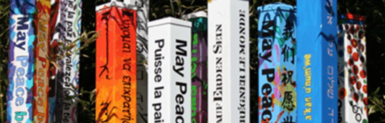 Peace poles from around the world, shown in multiple languages.