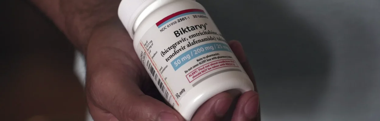 Fernando Hermida holds a bottle of Biktarvy, his HIV medication, in Charlotte, North Carolina.