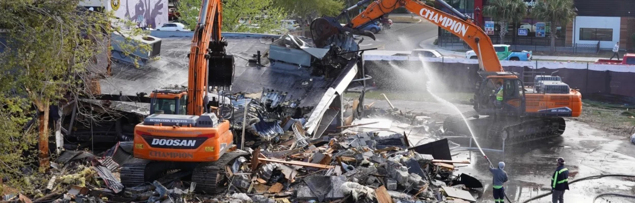 Piles of rubble surround excavators as they tear down the Pulse building.