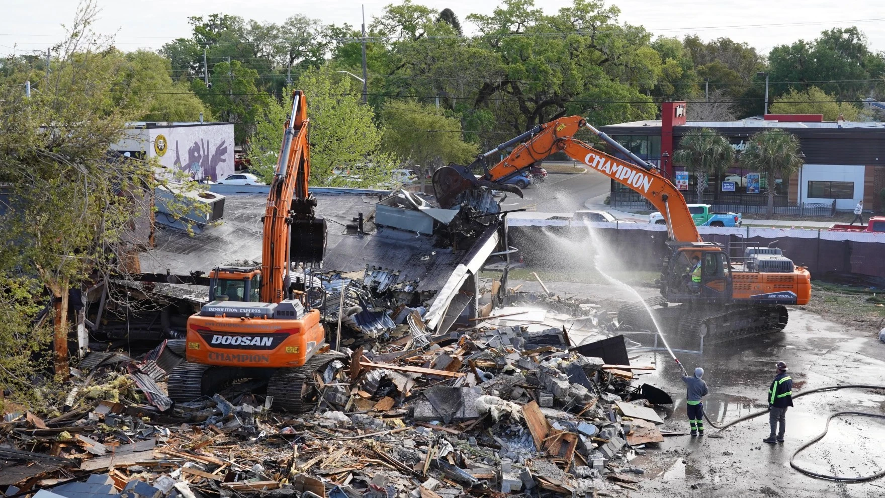 Piles of rubble surround excavators as they tear down the Pulse building.