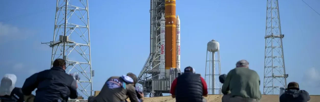 Media aim their remote cameras at NASA’s Artemis II Space Launch System rocket.