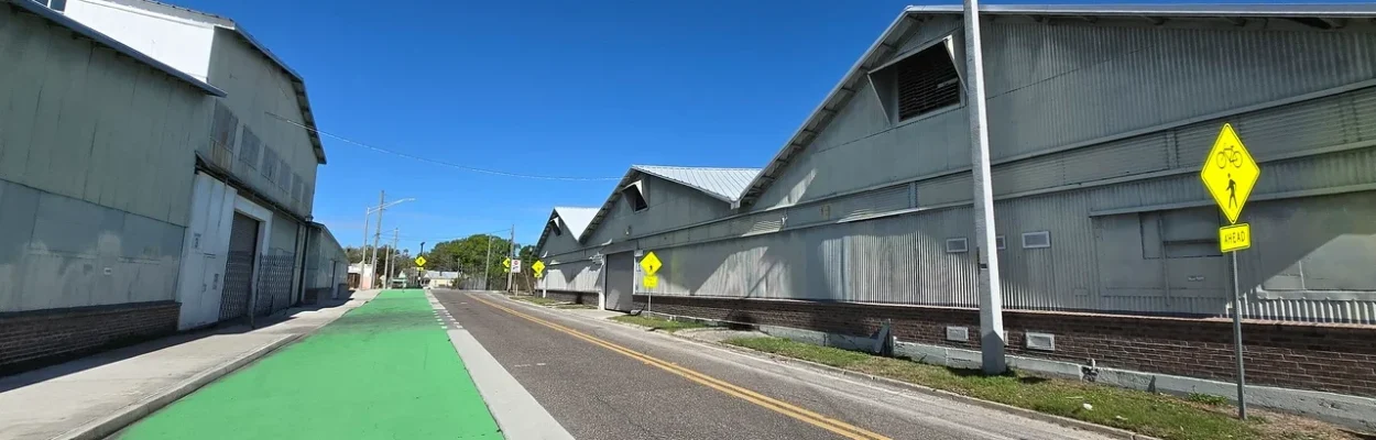 Old Moore Dry Kiln warehouses next to a modern street