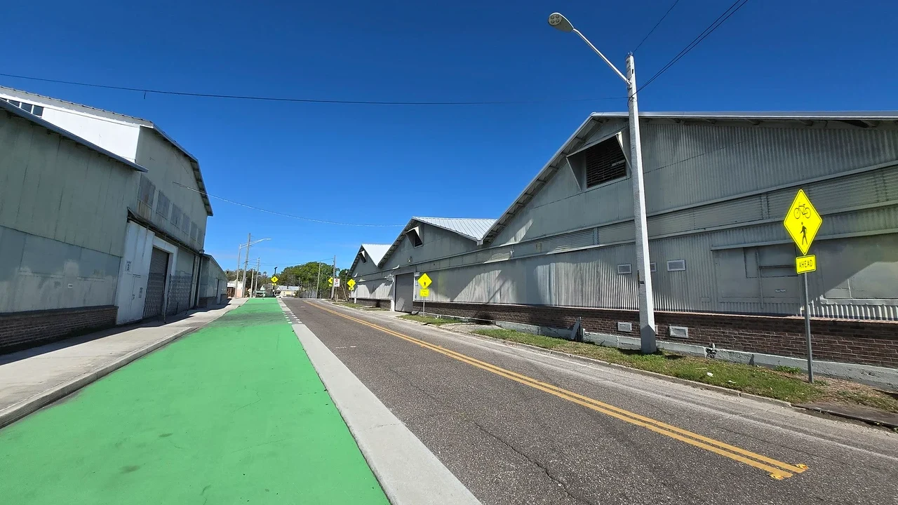 Old Moore Dry Kiln warehouses next to a modern street
