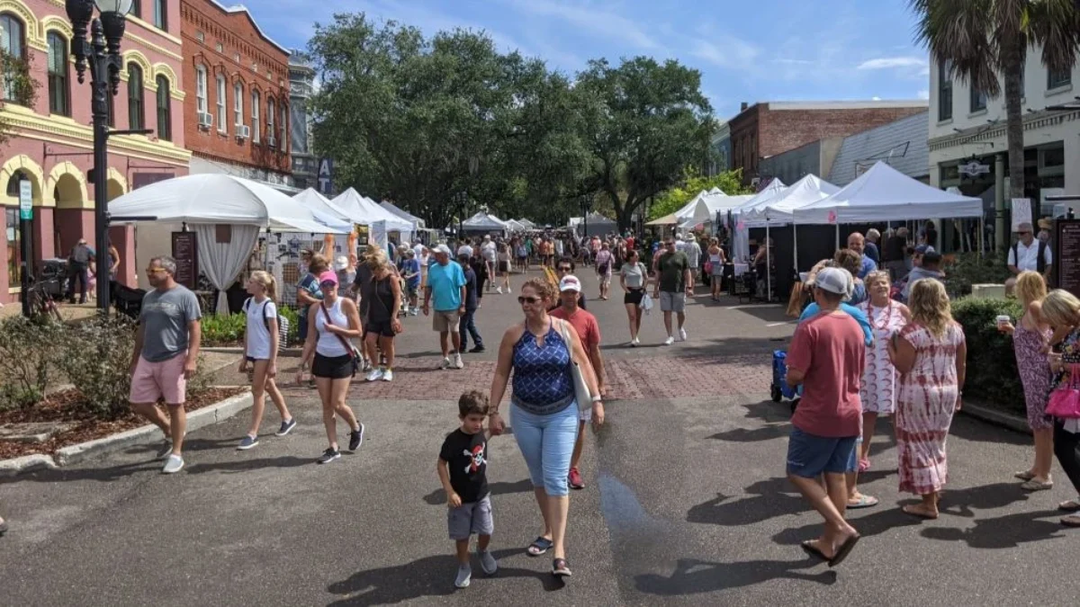 Crowds check out arts and crafts booths at the Shrimp Festival.