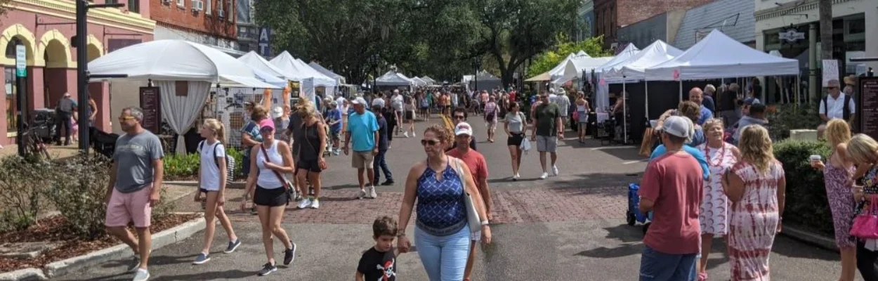 Crowds check out arts and crafts booths at the Shrimp Festival.