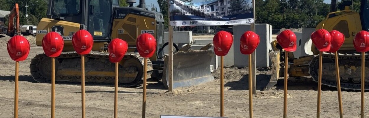 Helmets sit on shovels at a groundbreaking for the Villages at Lake Forest, an afordable housing development.