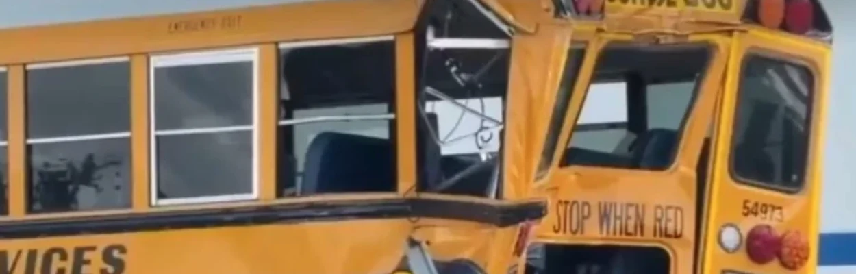 A crumpled school bus after a crash.