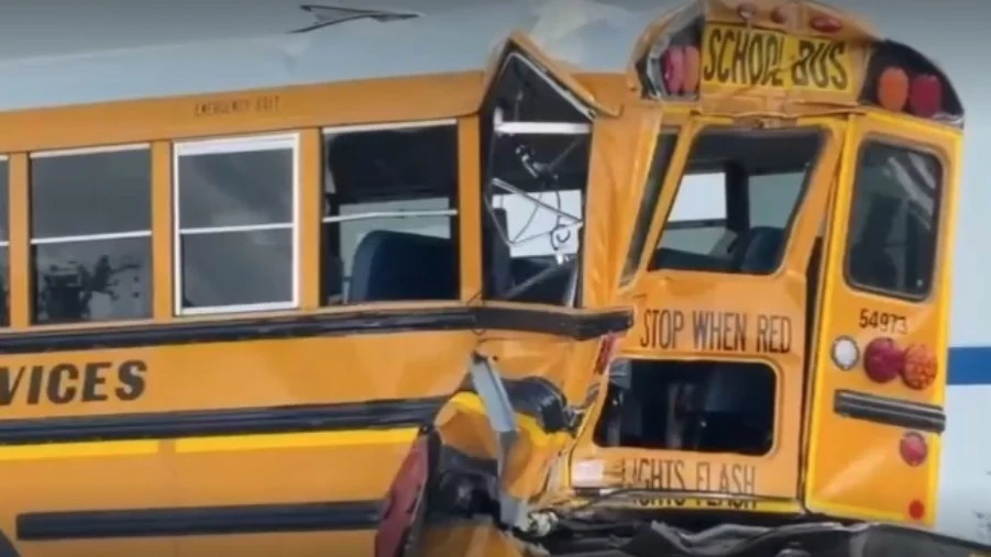 A crumpled school bus after a crash.