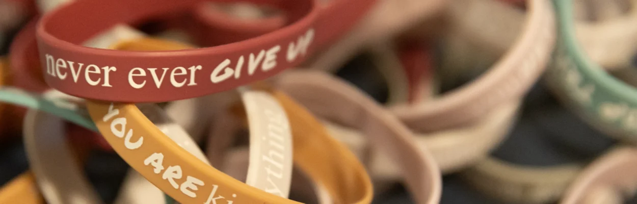 A group of wristbands from a student mental health conference.