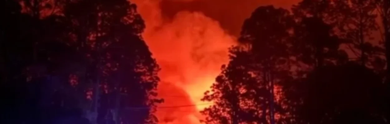 A billowing wildfire surrounded by trees in Southeast Georgia.
