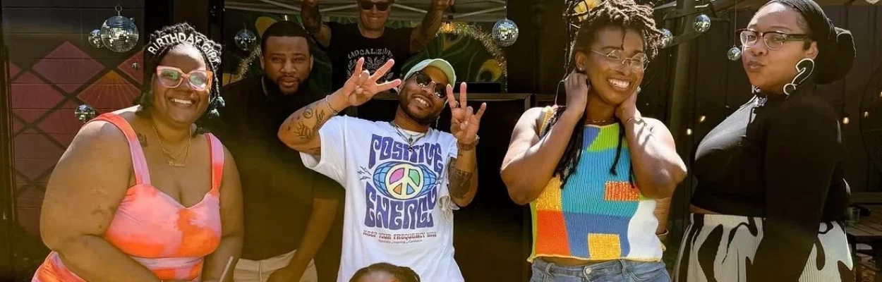 A group of friends smiles at Singalong Brunch