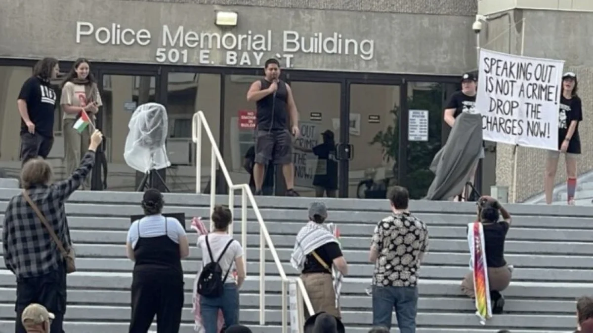 Supporters rally May 28, 2025, after three protesters were arrested at a City Council meeting.