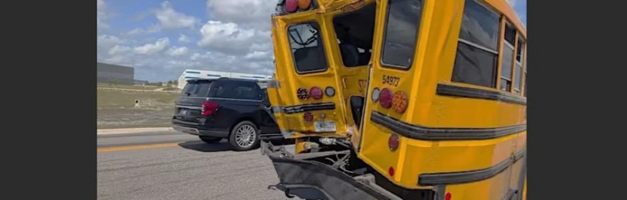 The crumped rear end of a school bus.