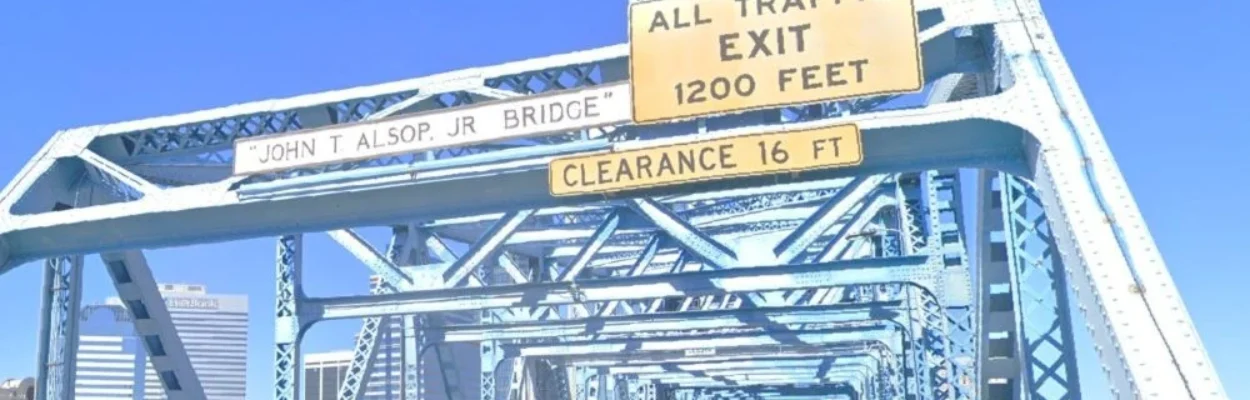 A sign shows the official name of the Main Street Bridge.
