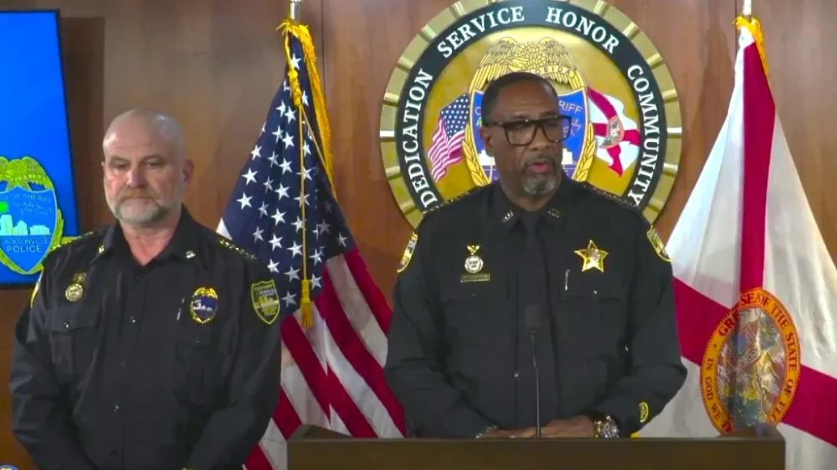 Sheriff T.K. Waters speaks at a lectern about phony police overtime.