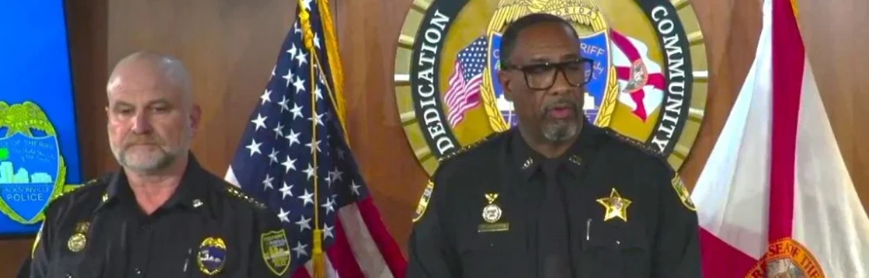 Sheriff T.K. Waters speaks at a lectern about phony police overtime.