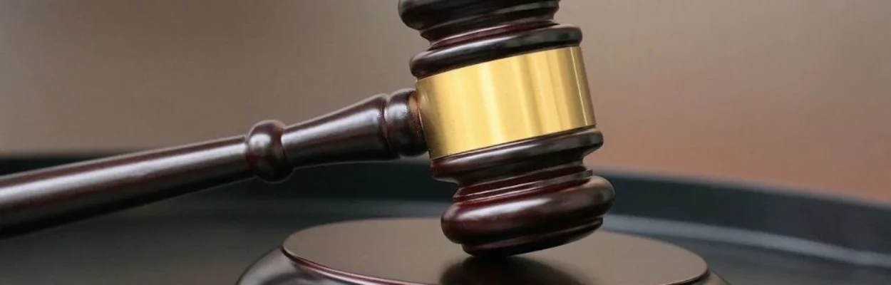 Judge's gavel. Teacher sentenced for enticing child.