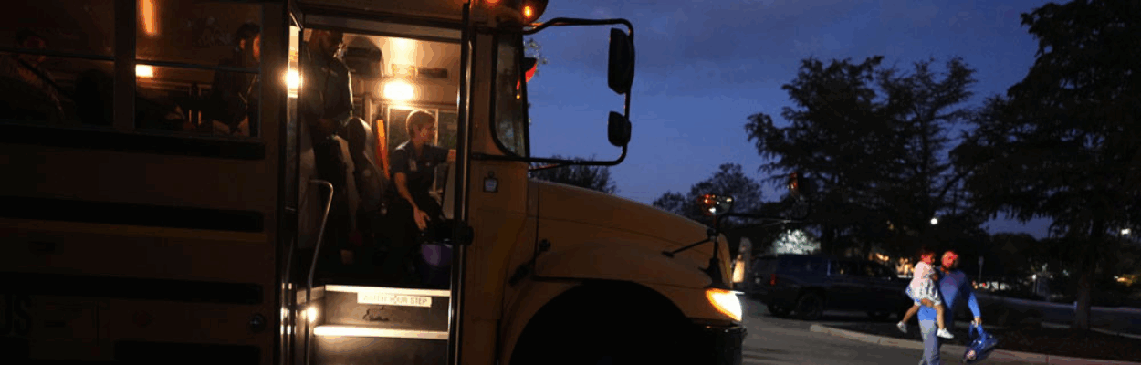 Students arrive to catch an early morning school bus, Oct. 9, 2025, in San Antonio. (AP Photo/Eric Gay)
