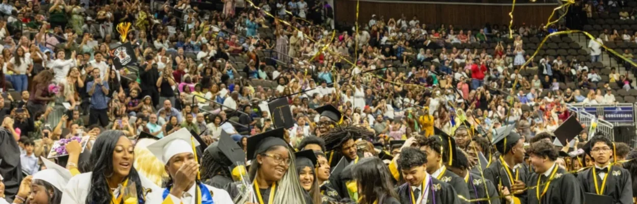 Students wear caps and gowns at Englewood's graduation ceremony