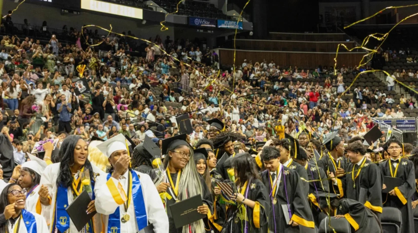 Students wear caps and gowns at Englewood's graduation ceremony