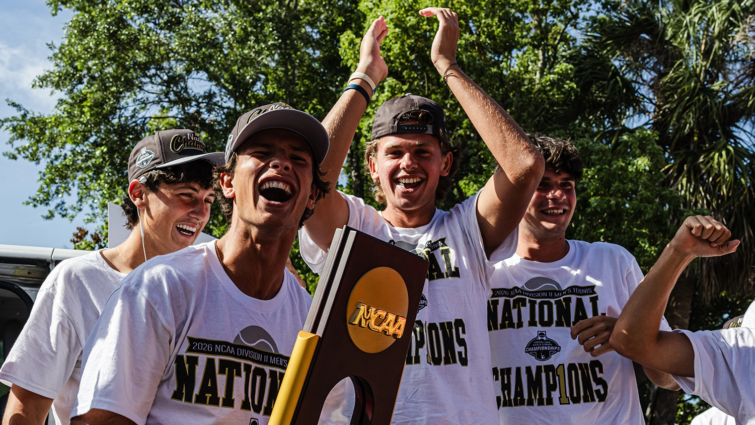 Flagler College's men's tennis team celebrates its national championship victory