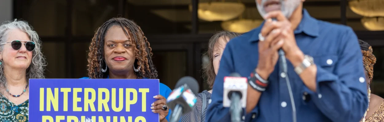 Activists protest potential jail sites in redlined neighborhoods.