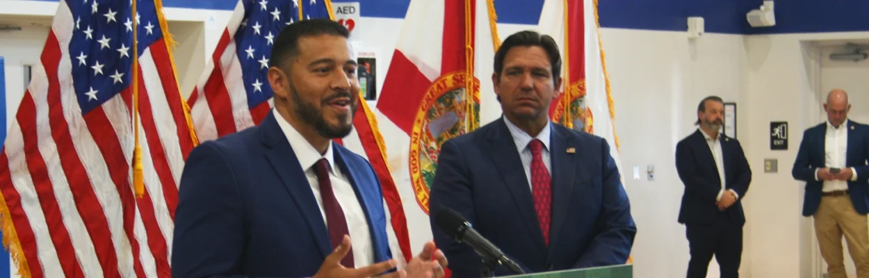 Education Commissioner Anastasios Kamoutsas joined Gov. Ron DeSantis at a bill-signing event at Jean Ribault High School on Friday, May 22, 2026. Both bills aim to support high school coaches.