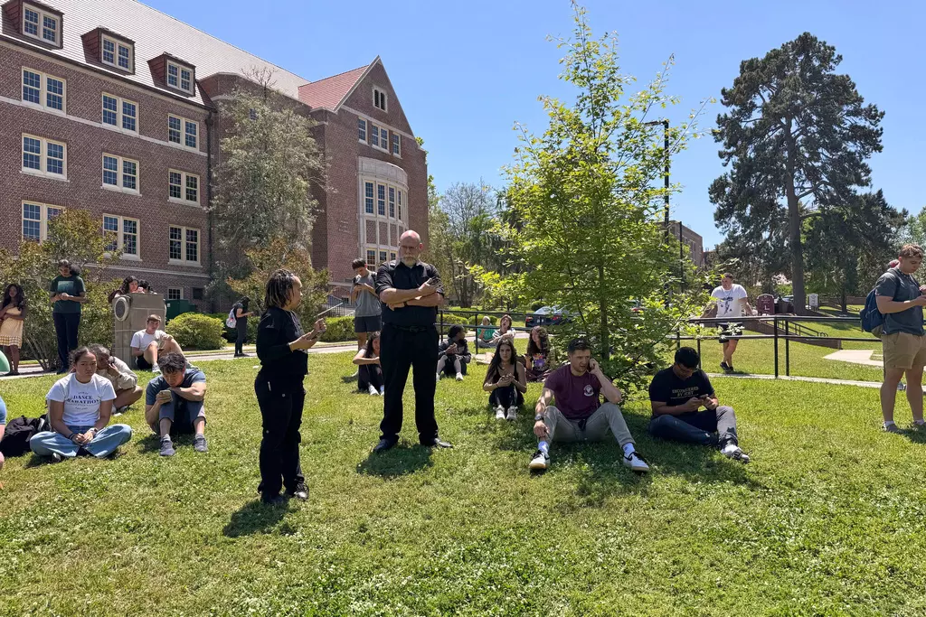 Florida State University students wait for news amid an active shooter incident at the school’s campus April 17, 2025, in Tallahassee.