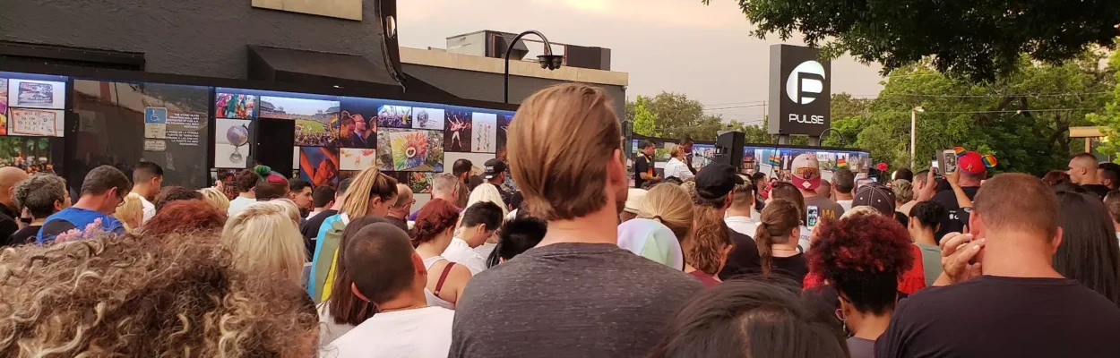 Hundreds gather to grieve on June 12, 2018, outside of the Pulse Nightclub. Ten years after the Pulse Nightclub shooting, the community remains changed both in ways of pain and grief, but also in embracing communities from around the region, experts say.
