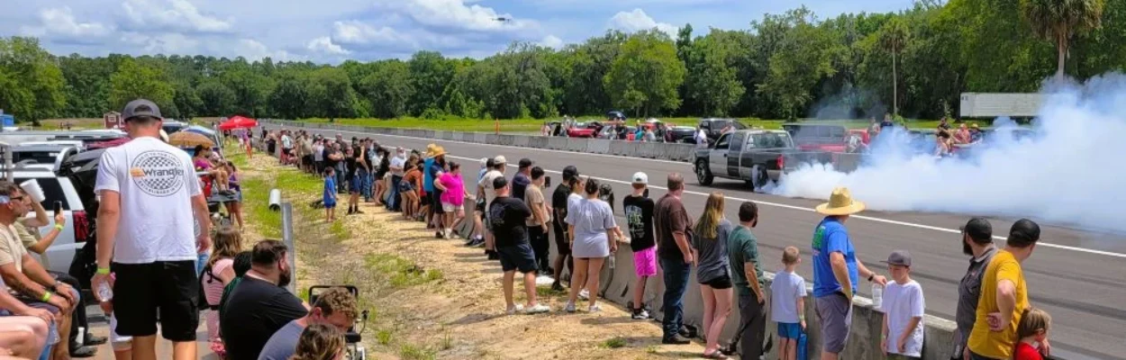 Cars do burnouts on the track of Hicken Power Dragstrip