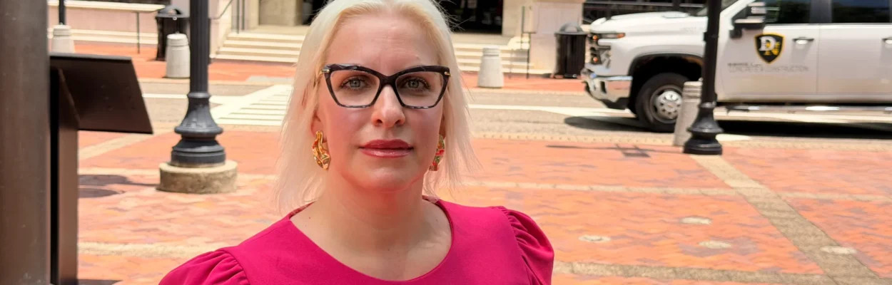 Libertarian Addison Patrick stands in front of Jacksonville City Hall.