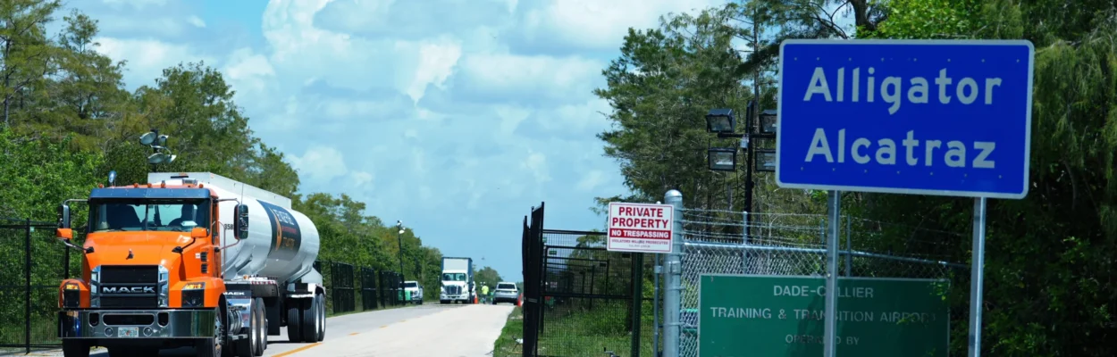 A truck approaches the entrance to "Alligator Alcatraz."